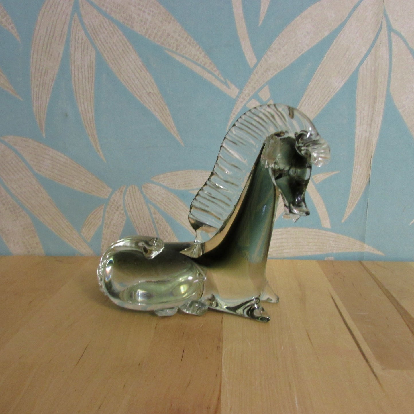 Vintage solid glass Trojan-style resting horse statuette