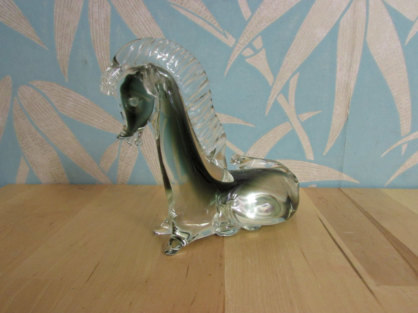 Vintage solid glass Trojan-style resting horse statuette