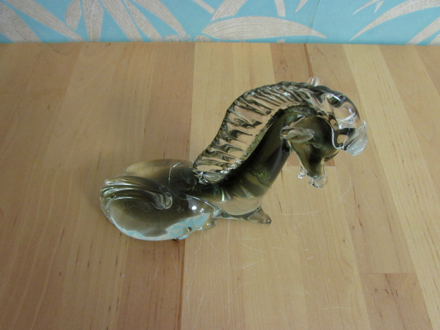 Vintage solid glass Trojan-style resting horse statuette