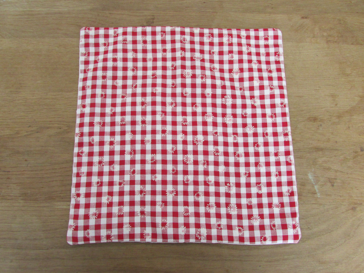 Home-made vintage red & white Gingham cushion cover with allover daisy motif and contrast white reverse