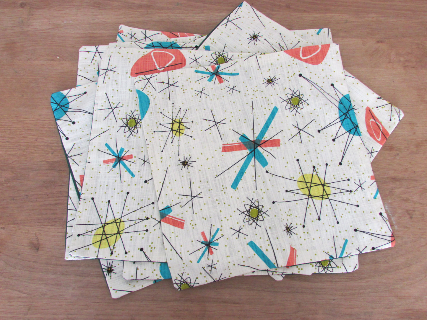 Home-made 1950s-inspired Atomic Starburst pattern cushion cover with contrast green OR rust reverse