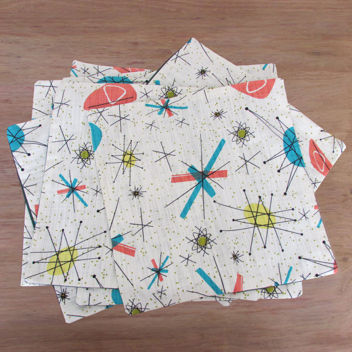 Handmade retro 1950s-inspired Atomic Starburst cushion cover, green or rust reverse. 14" x 14"