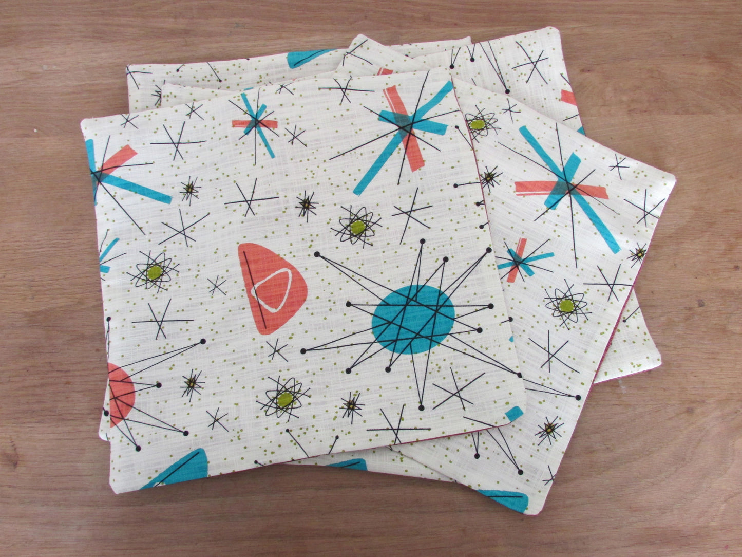 Home-made 1950s-inspired Atomic Starburst pattern cushion cover with contrast green OR rust reverse