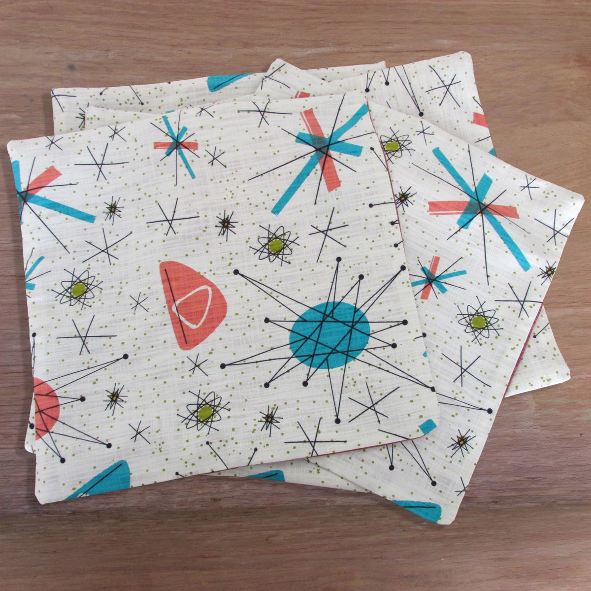 Handmade retro 1950s-inspired Atomic Starburst cushion cover, green or rust reverse. 14" x 14"