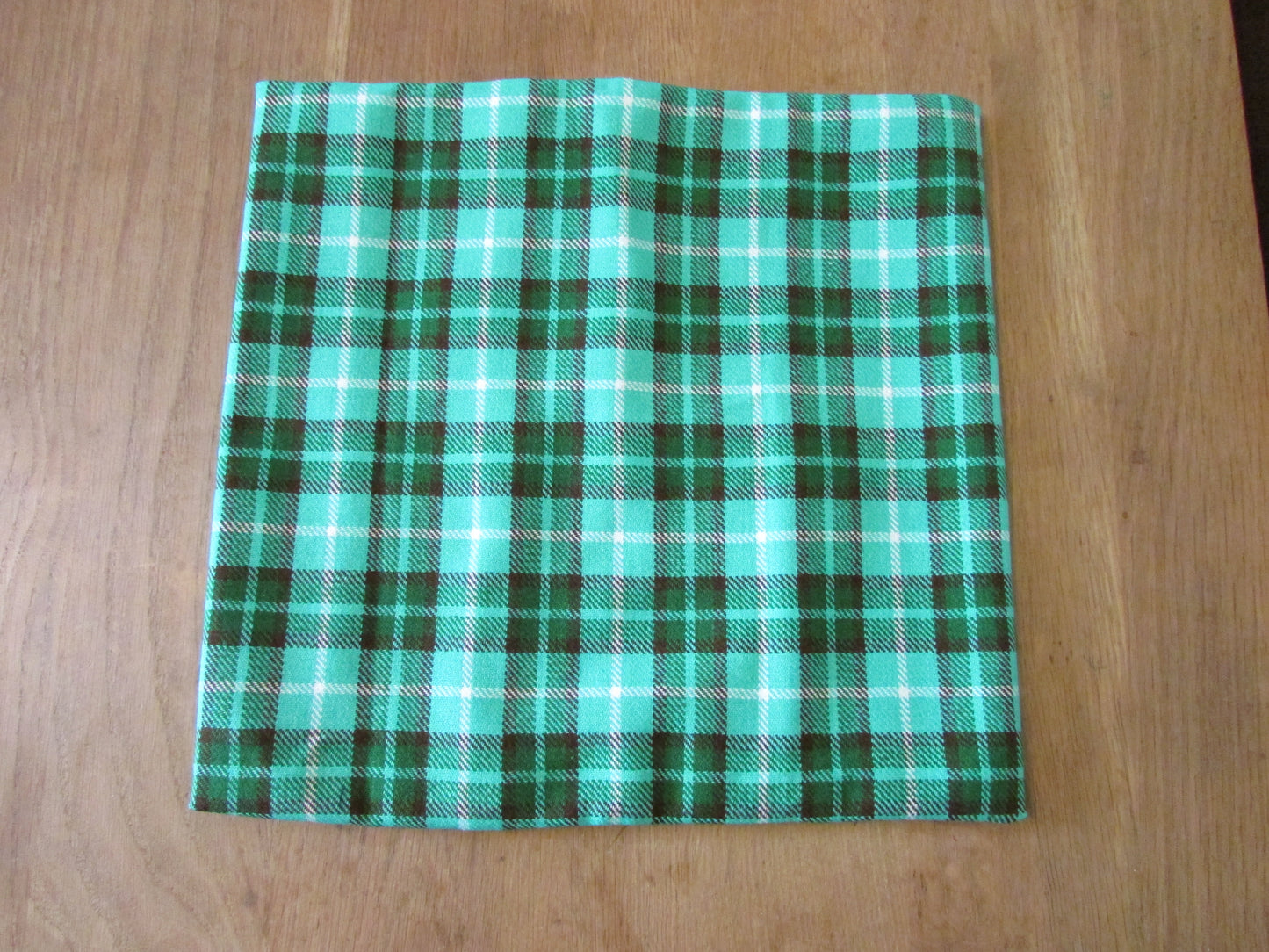 Home-made vintage green plaid cushion cover with same pattern reverse