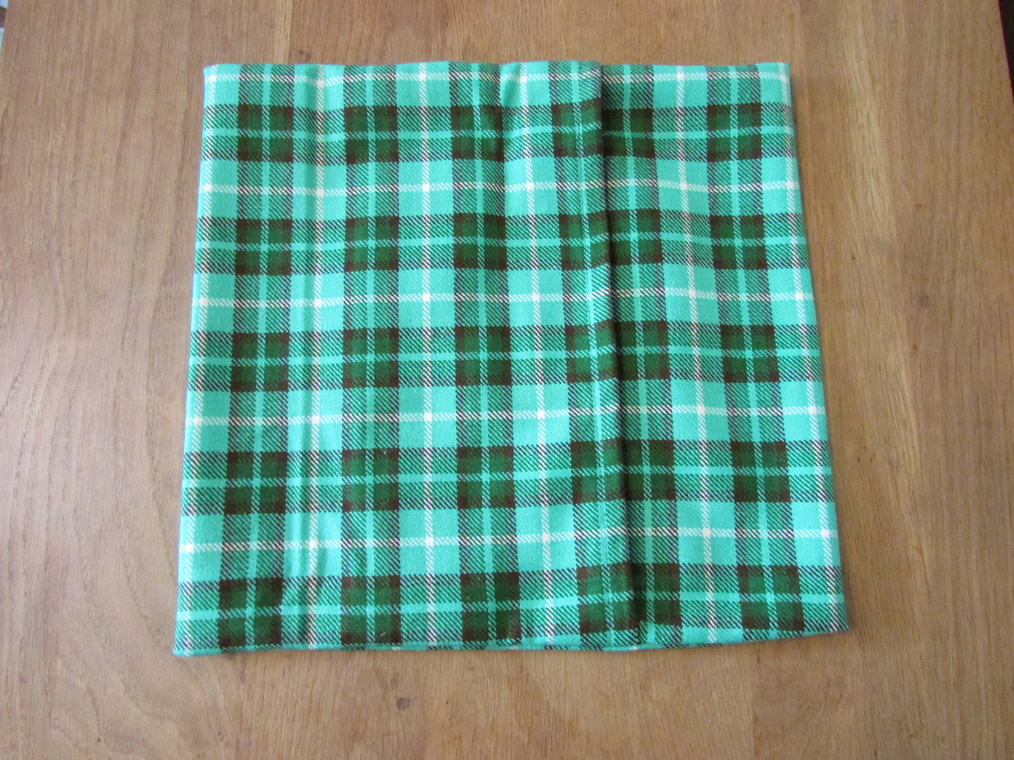Home-made vintage green plaid cushion cover with same pattern reverse