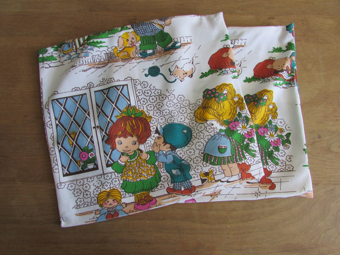Two vintage hand-made Holly Hobbie-style cushion covers
