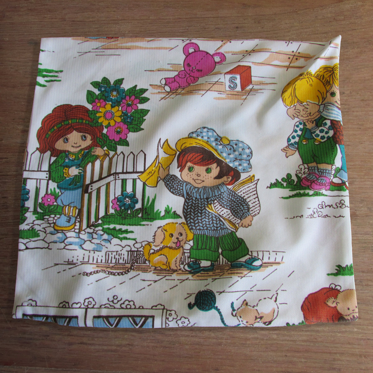 Pair of vintage handmade 1970s Holly Hobbie-style cushion covers, 15" x 15"