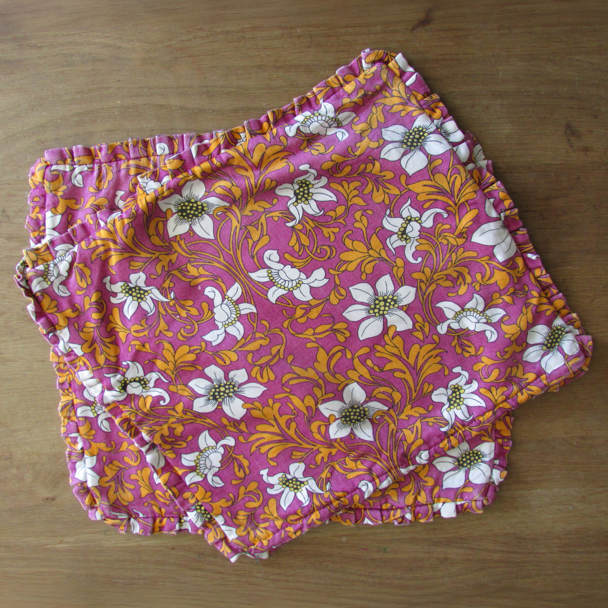 Pair of 1970s pink orange floral frilled cushion covers, 18" x 15"