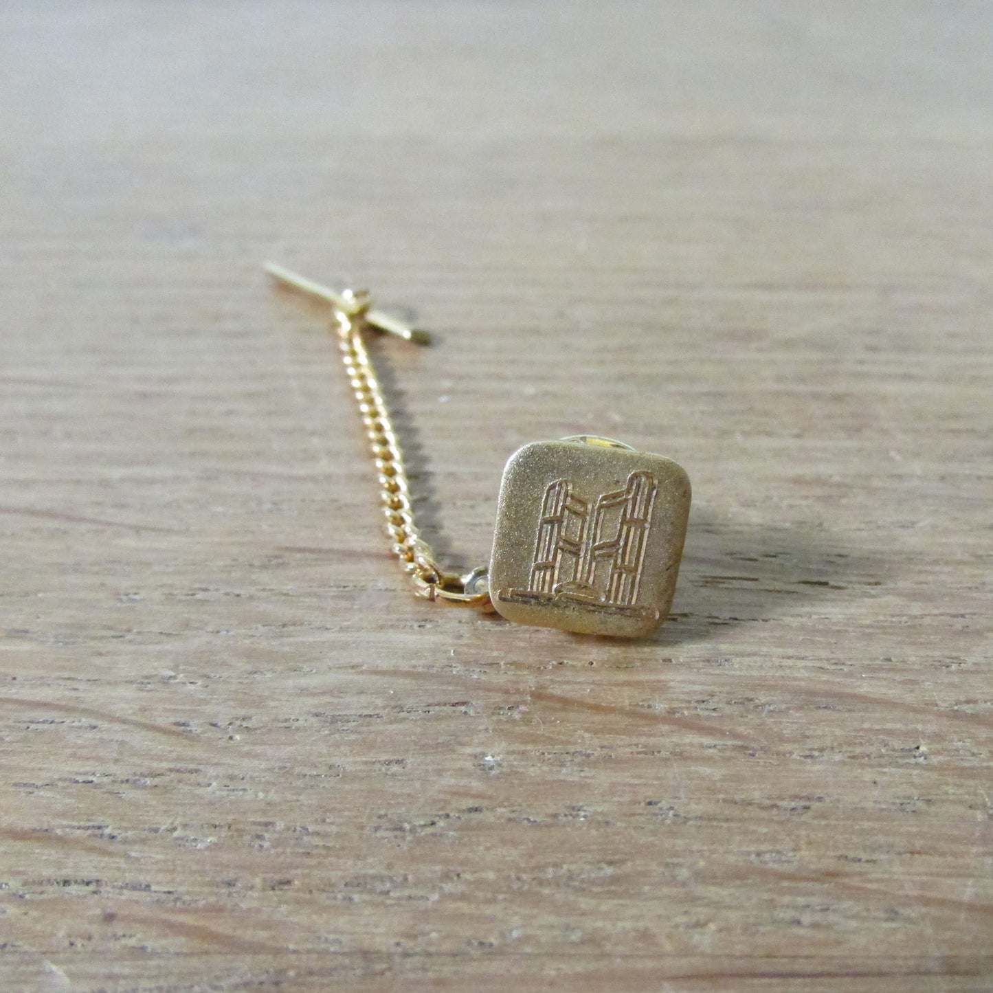 Vintage gold-tone etched tie tack