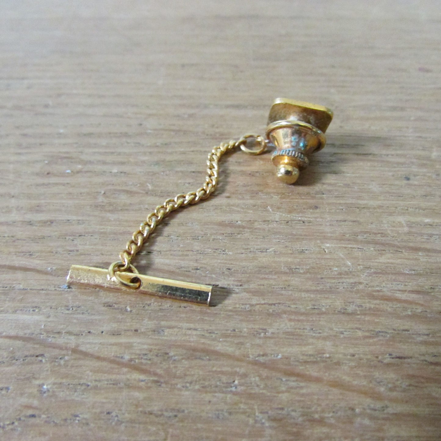 Vintage gold-tone etched tie tack