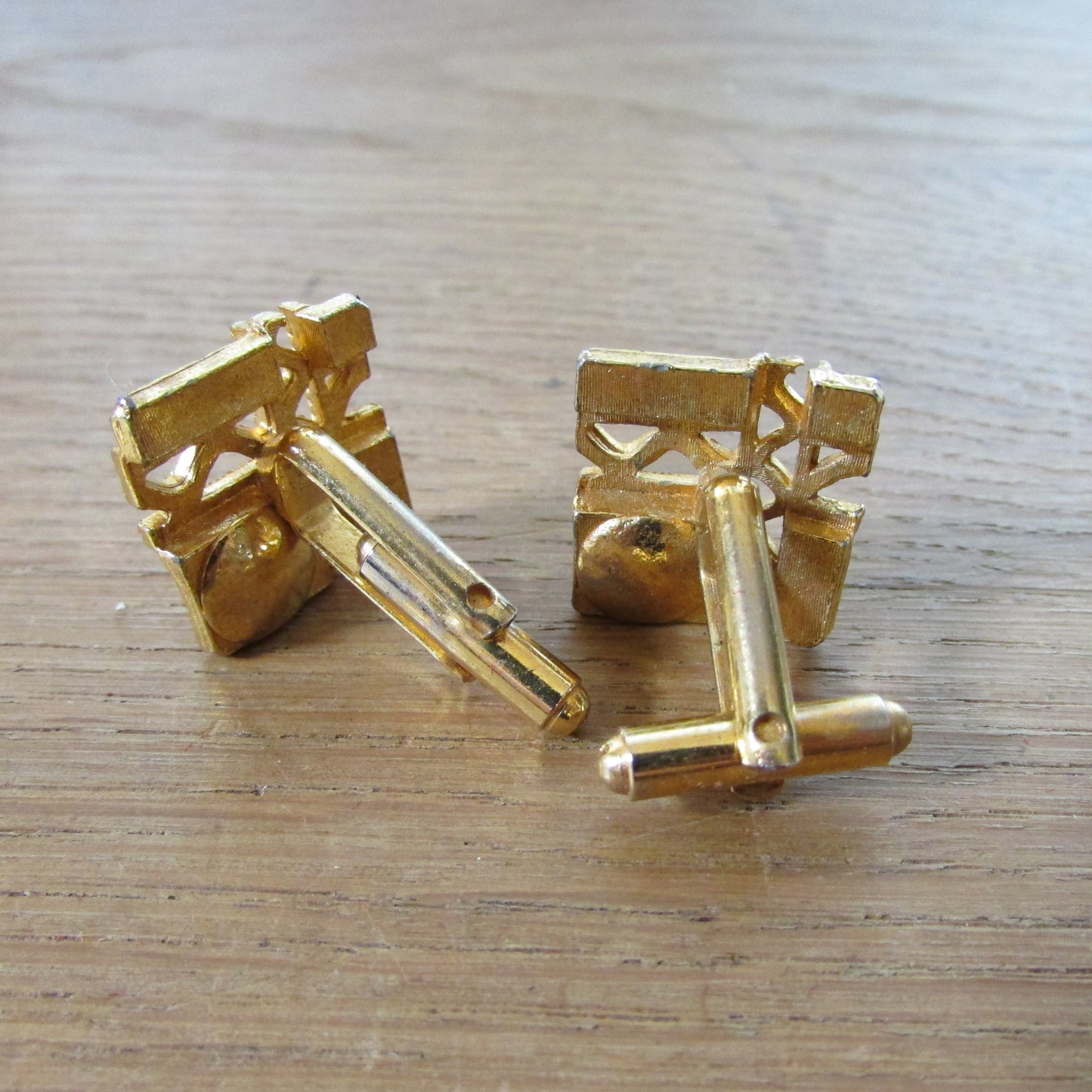 1960s Merlin diamond-cut gold-tone cufflinks with purple rhinestone detail