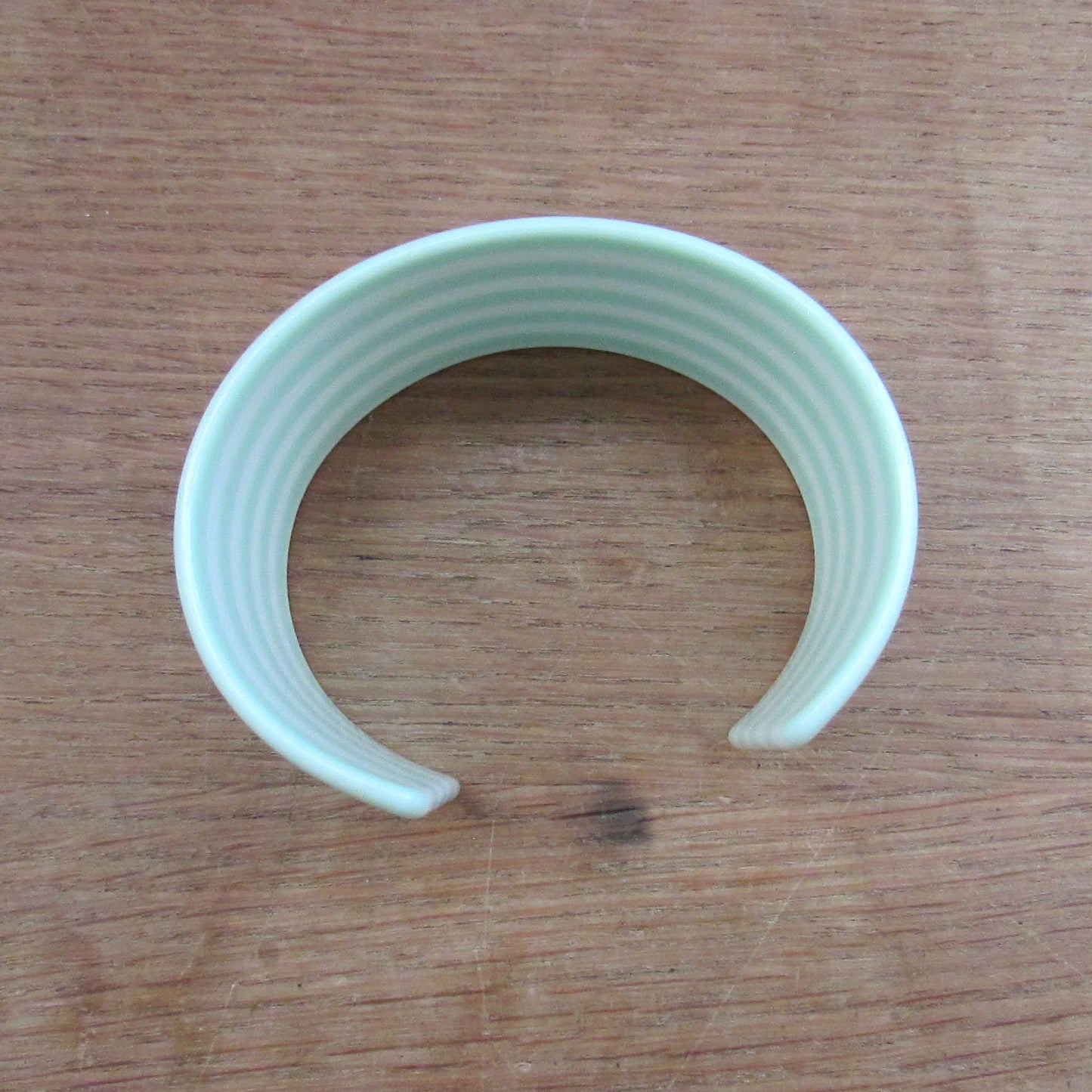 circa. 1980s mint green & white striped plastic open cuff bangle