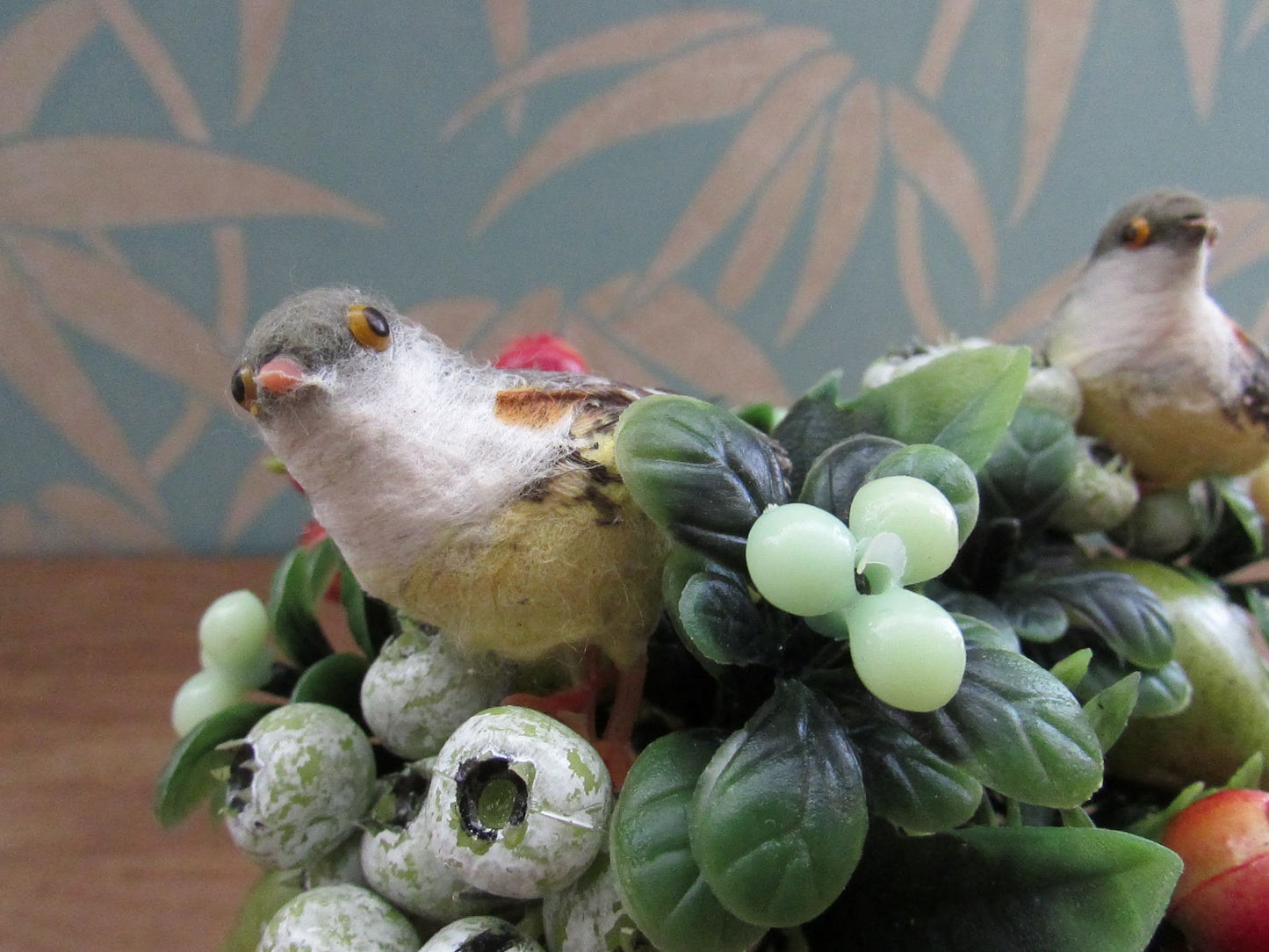 Two 1960s plastic partridges on pear tree branches, & red rosehip berry sprigs