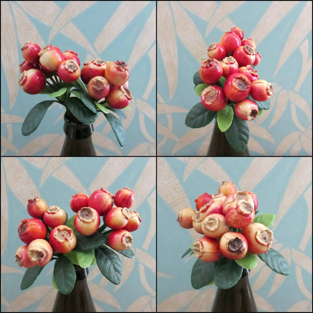Two 1960s plastic partridges on pear tree branches, & red rosehip berry sprigs