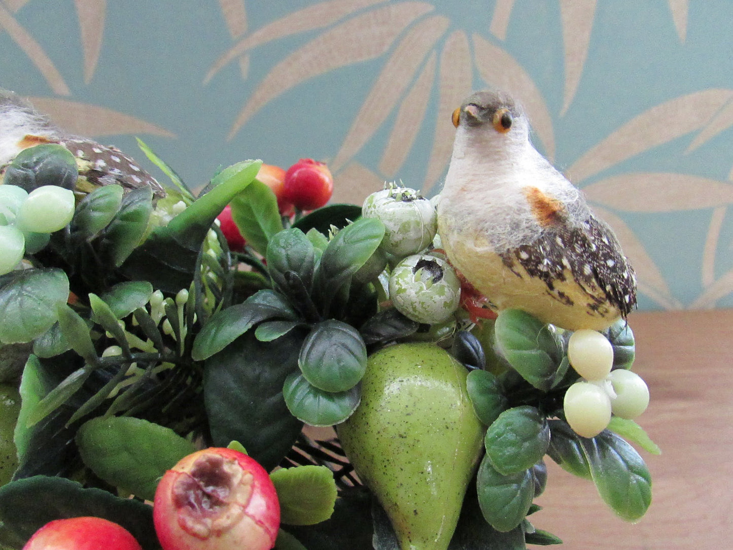 Two 1960s plastic partridges on pear tree branches, & red rosehip berry sprigs