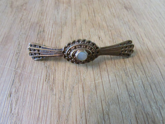 Vintage copper-tone Marcasite bar brooch with central MOP cabochon