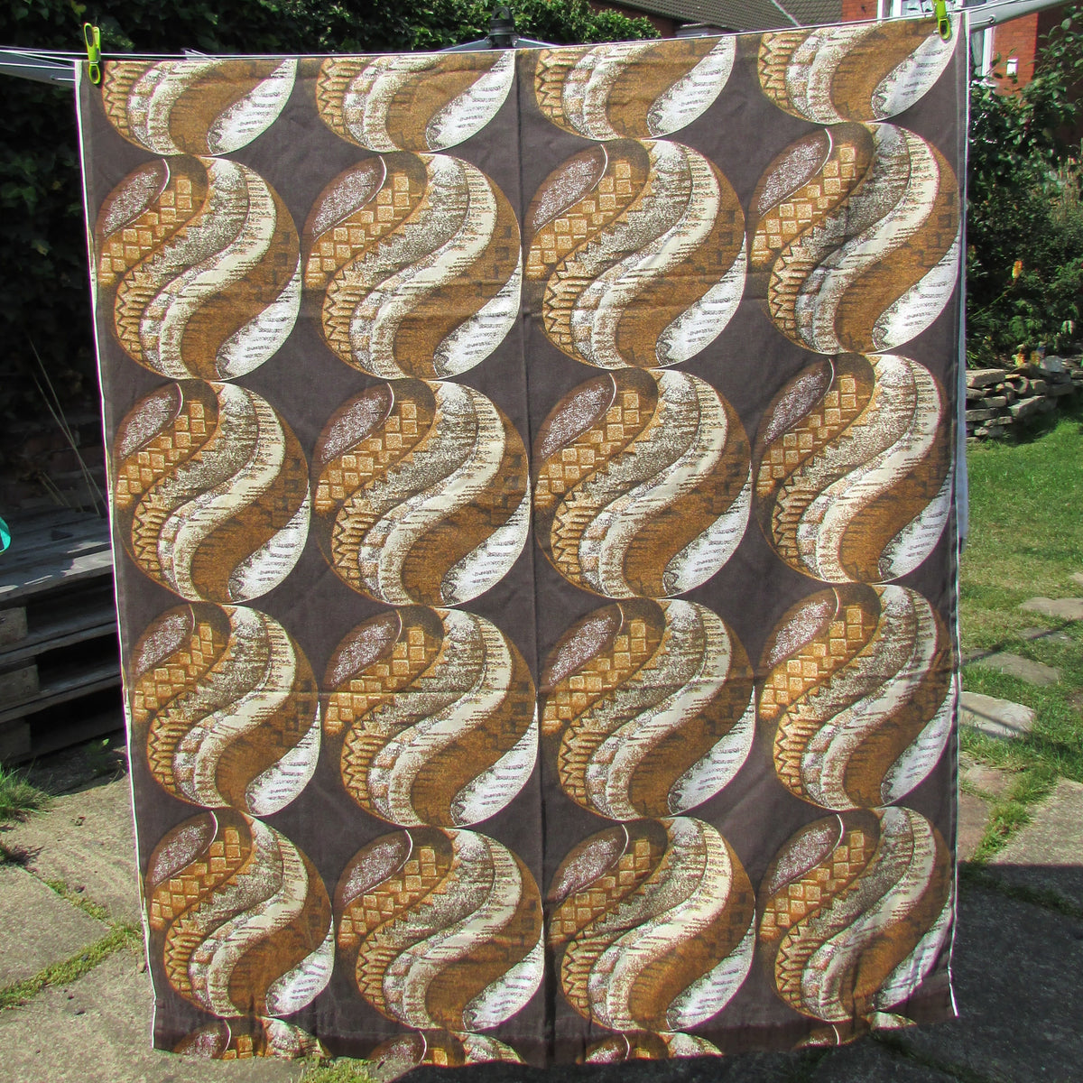 1960s brown & ochre geometric swirl roundel fabric, 46" x 82"