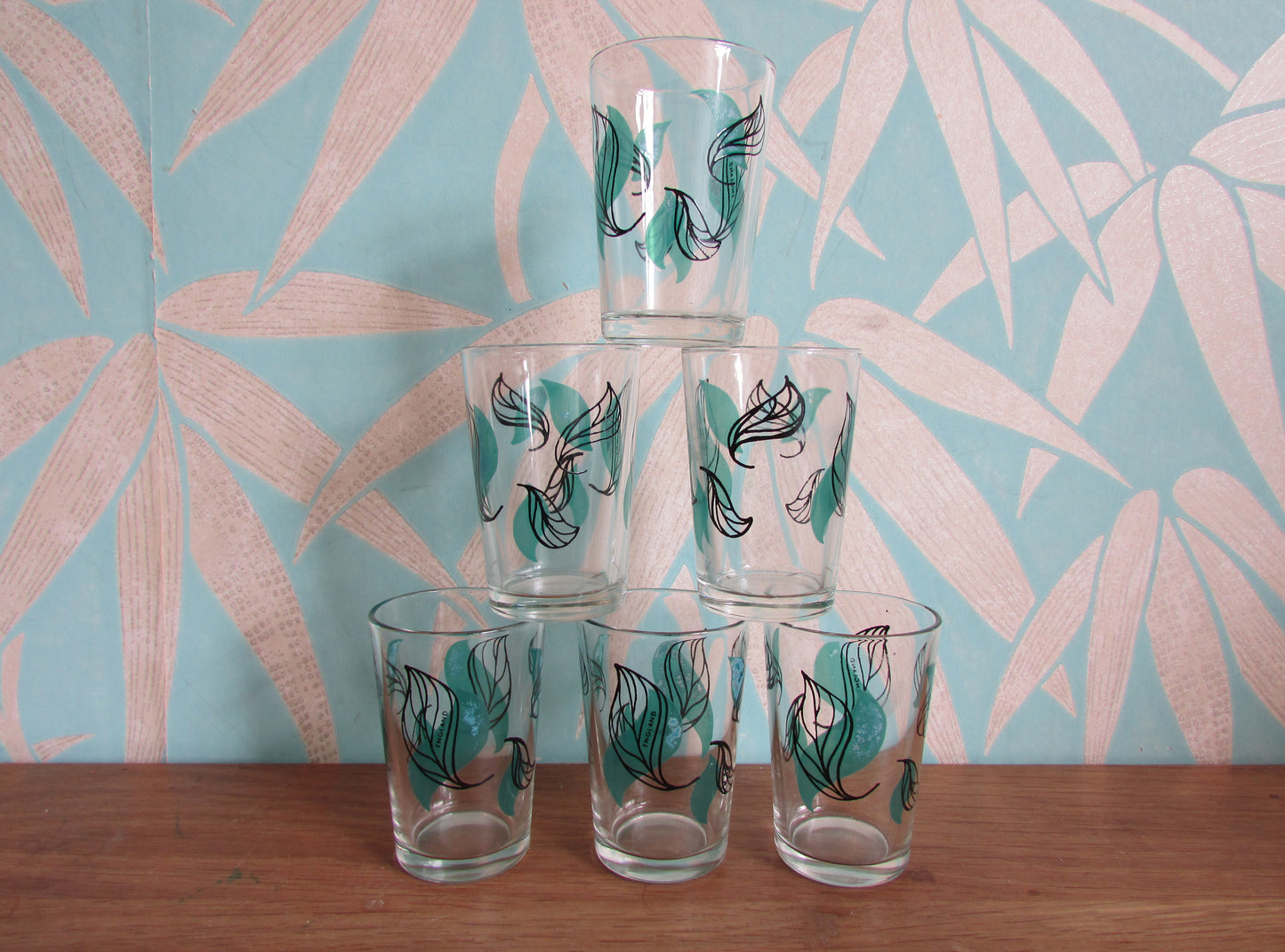 Set of six 1950s green & black leaf patterned shot glasses, made in England