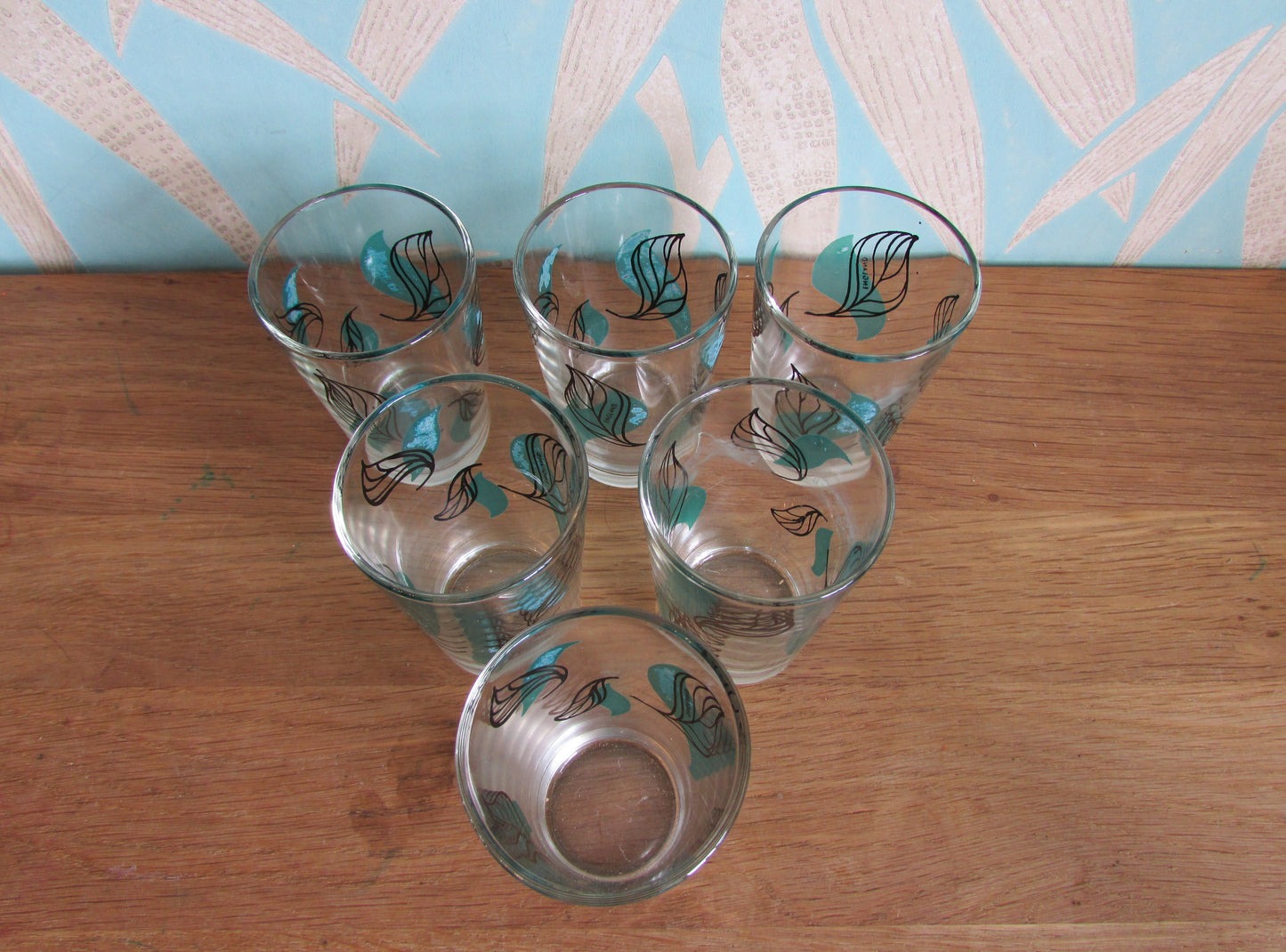 Set of six 1950s green & black leaf patterned shot glasses, made in England