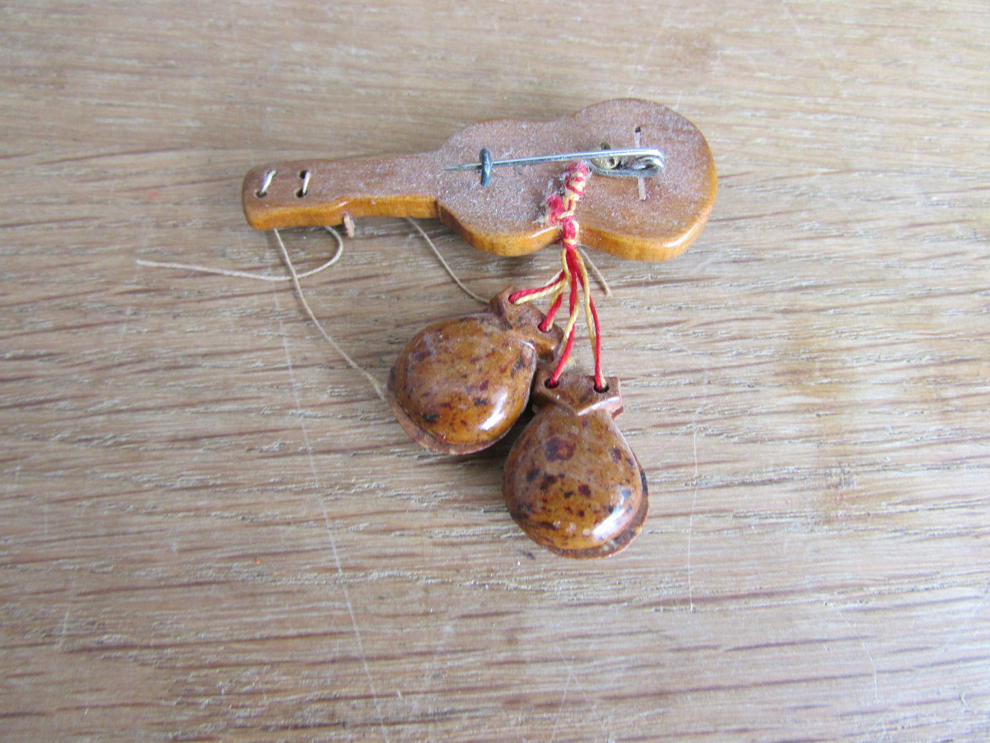 Vintage wooden hand-painted guitar brooch with castanets