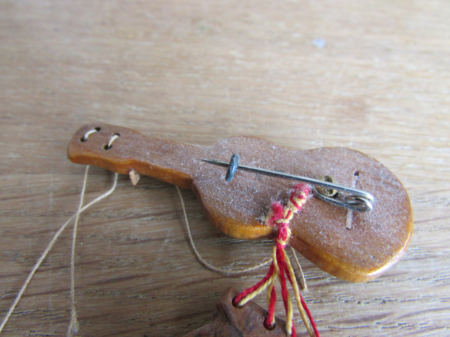 Vintage wooden hand-painted guitar brooch with castanets