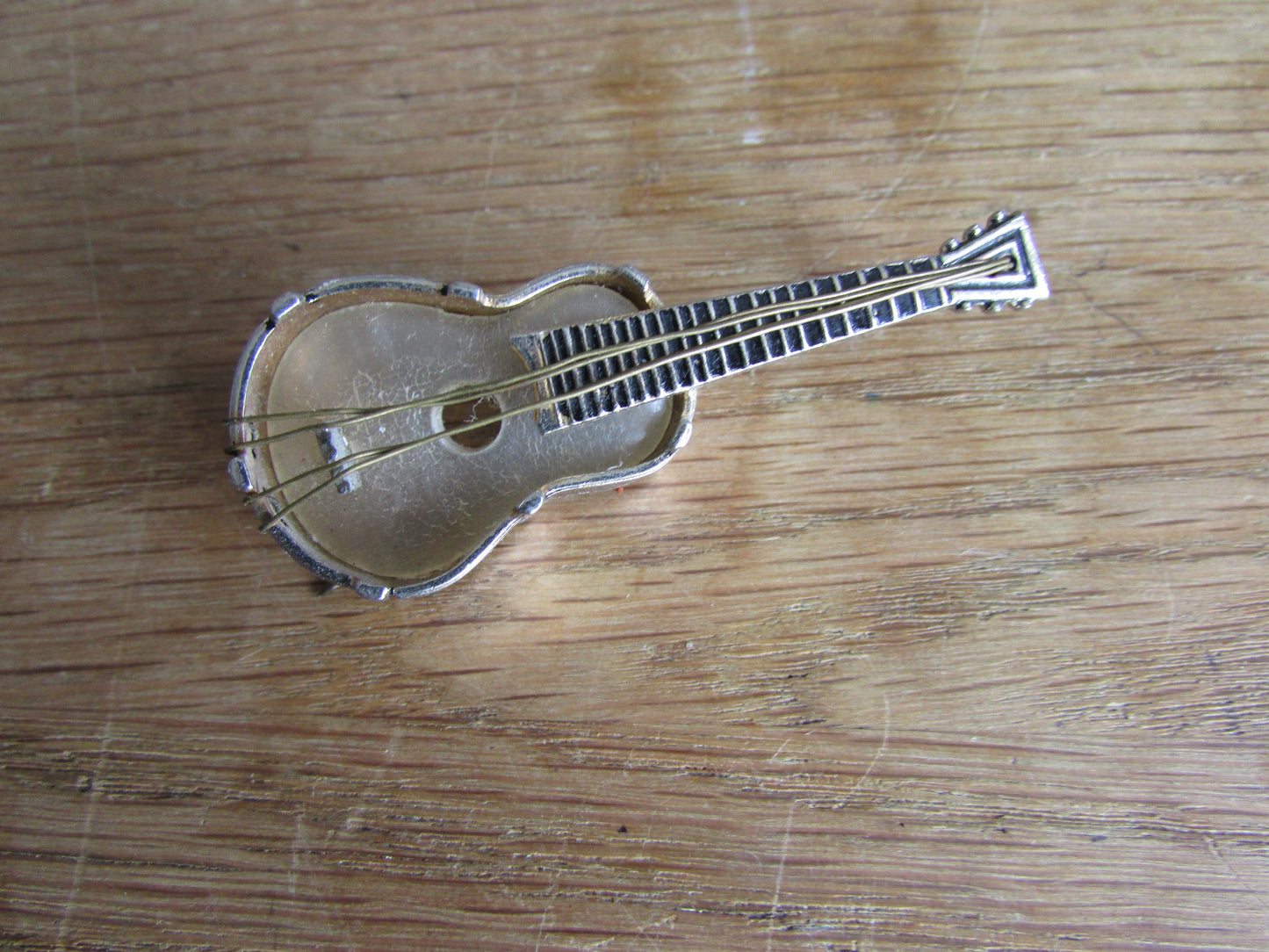 Vintage MOP & silver-tone Toledo guitar brooch