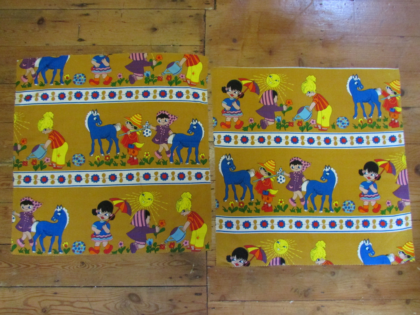Pair of brightly coloured 1970s children's/nursery fabric squares