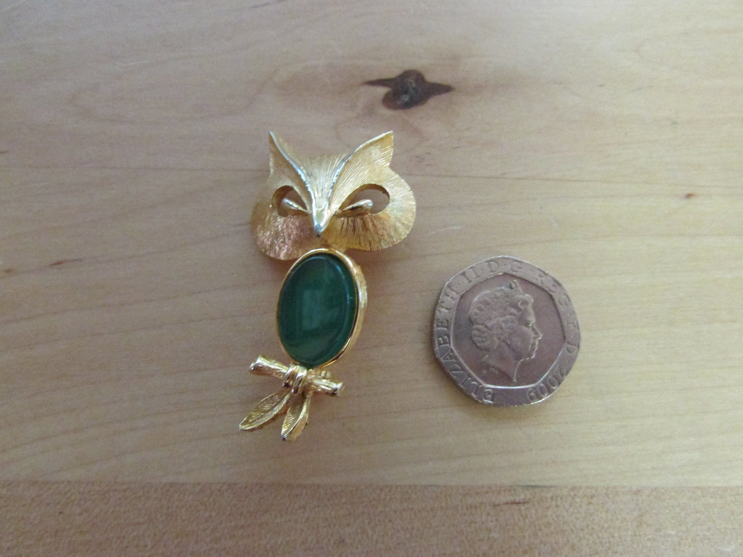 Vintage Liz Clairborne modernist-style gold-tone owl brooch with green cabochon belly