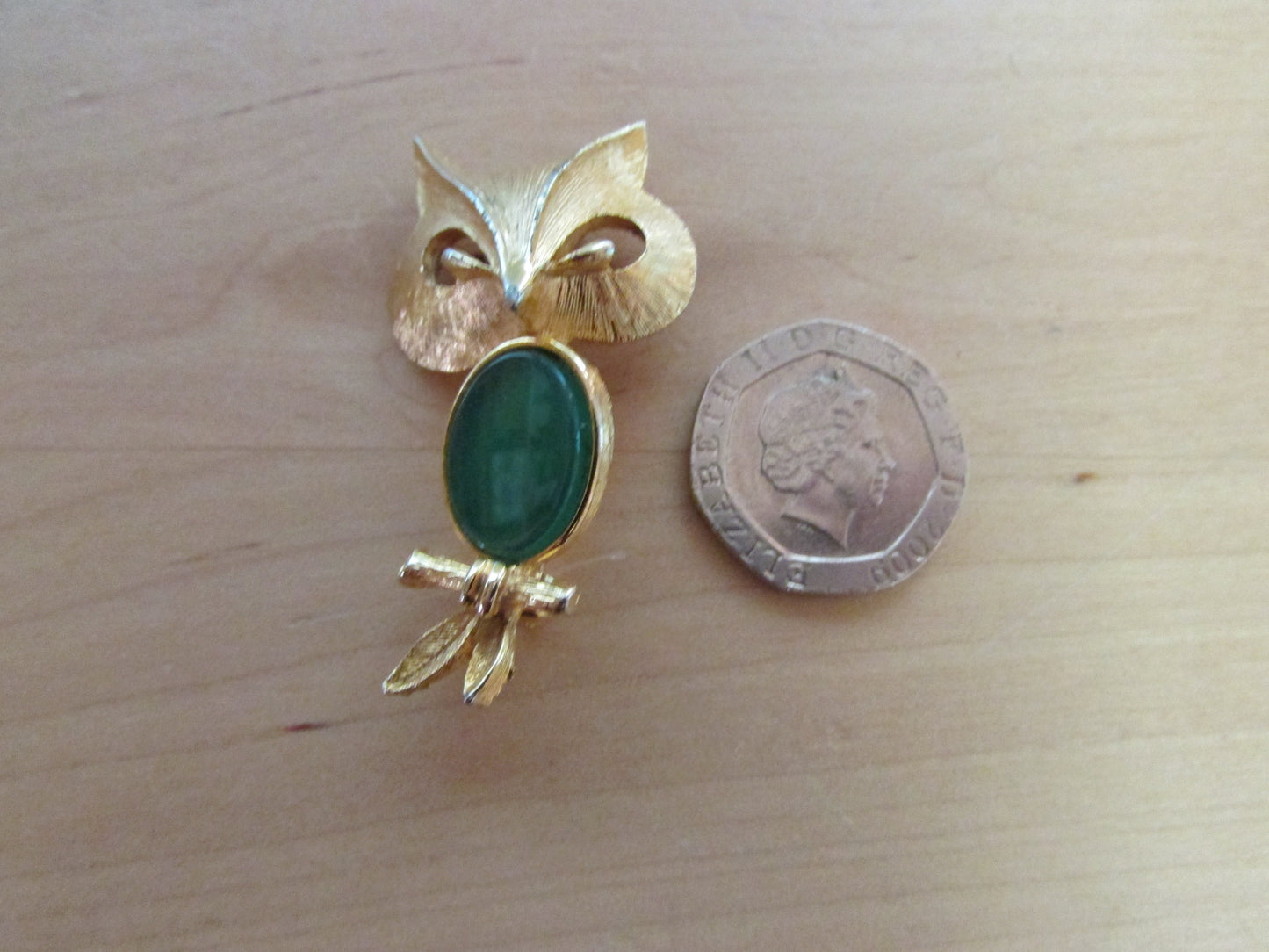 Vintage Liz Clairborne modernist-style gold-tone owl brooch with green cabochon belly