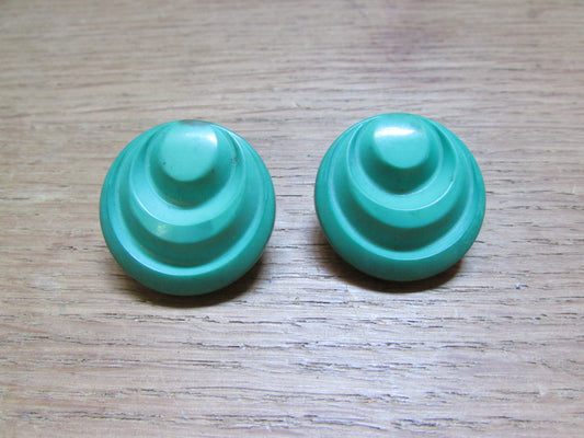 Large vintage round green plastic ridged earrings marked 1689