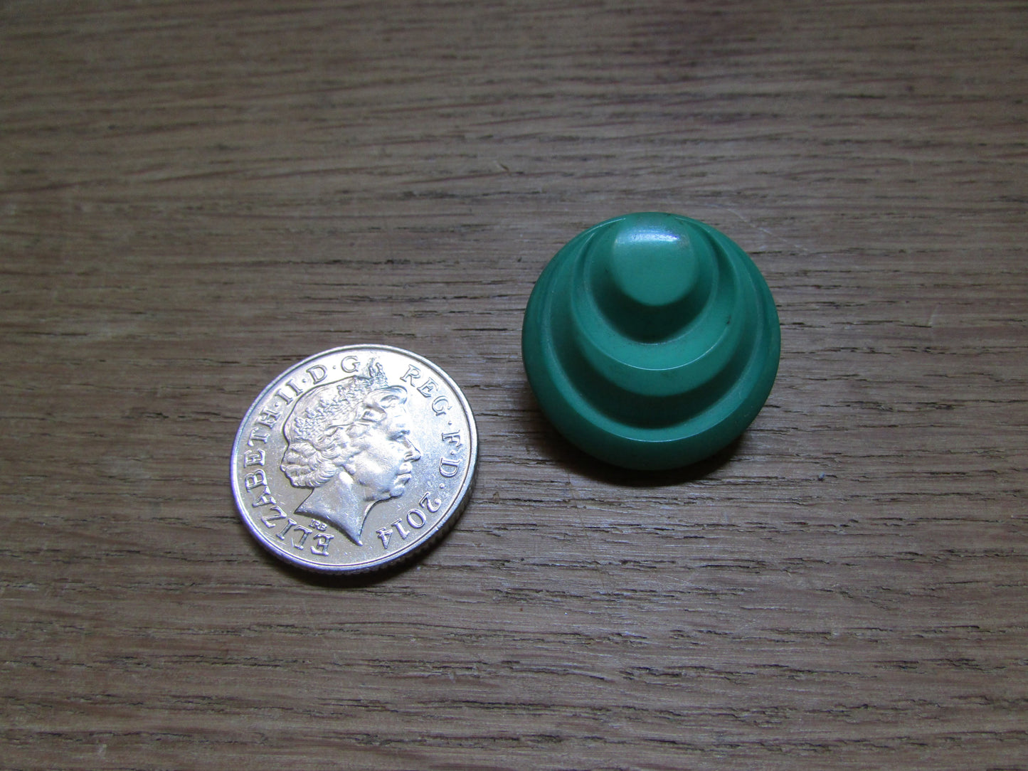 Large vintage round green plastic ridged earrings marked 1689