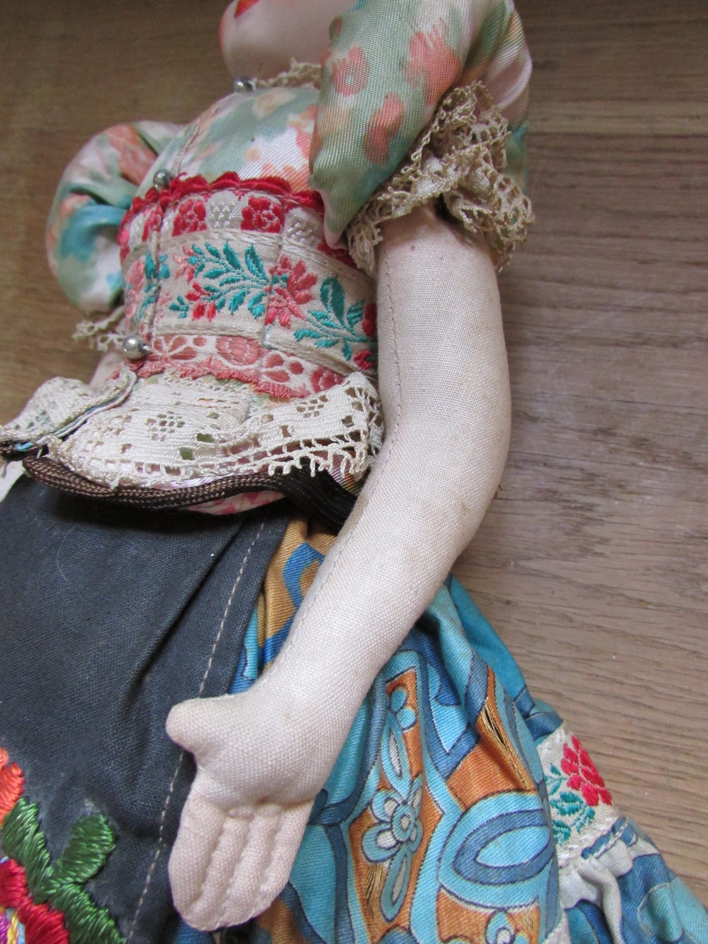 Vintage Hungarian folk art doll in traditional dress, with handpainted porcelain face, & cloth limbs