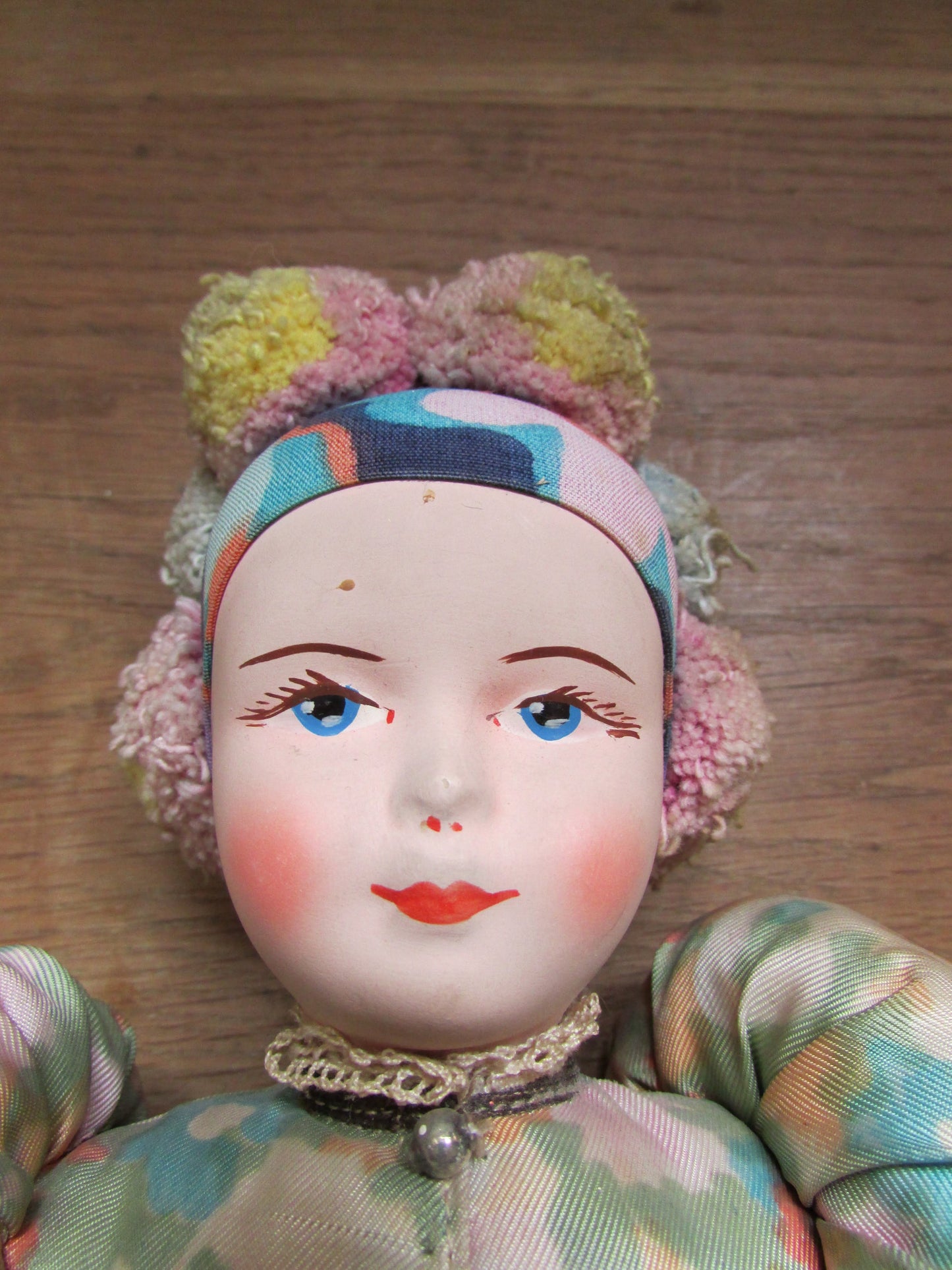 Vintage Hungarian folk art doll in traditional dress, with handpainted porcelain face, & cloth limbs
