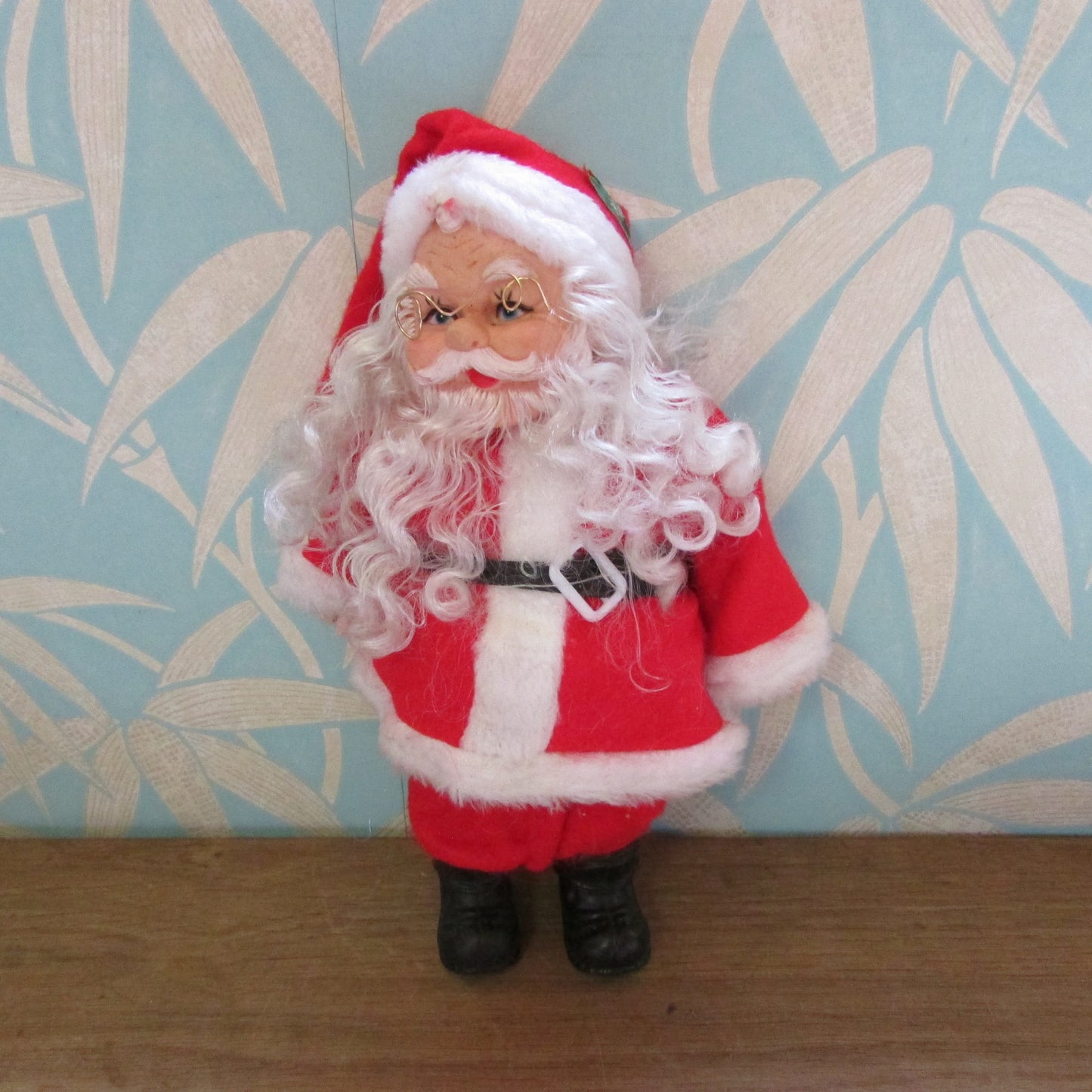 circa. 1980s hard plastic Santa Claus doll with wire spectacles
