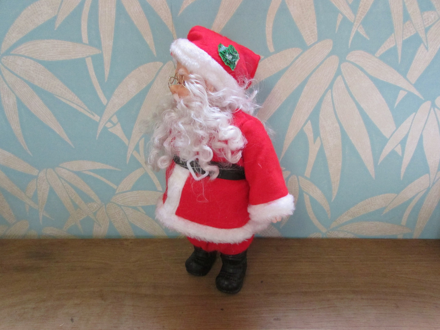 circa. 1980s hard plastic Santa Claus doll with wire spectacles