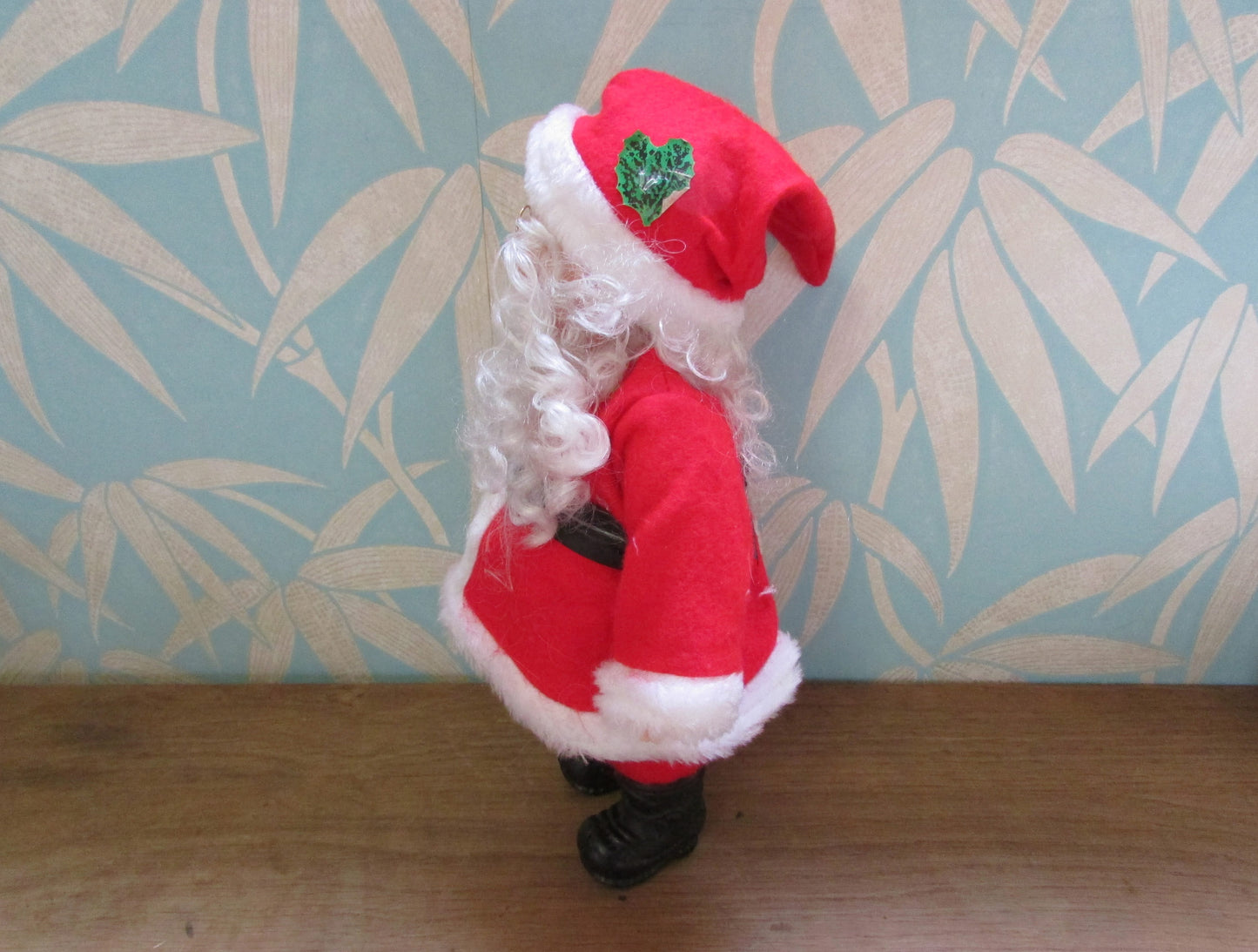 circa. 1980s hard plastic Santa Claus doll with wire spectacles