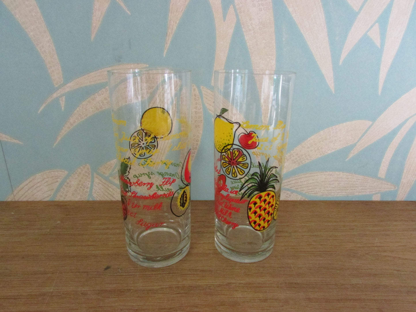 Pair of vintage retro cocktail recipe themed hi-balls