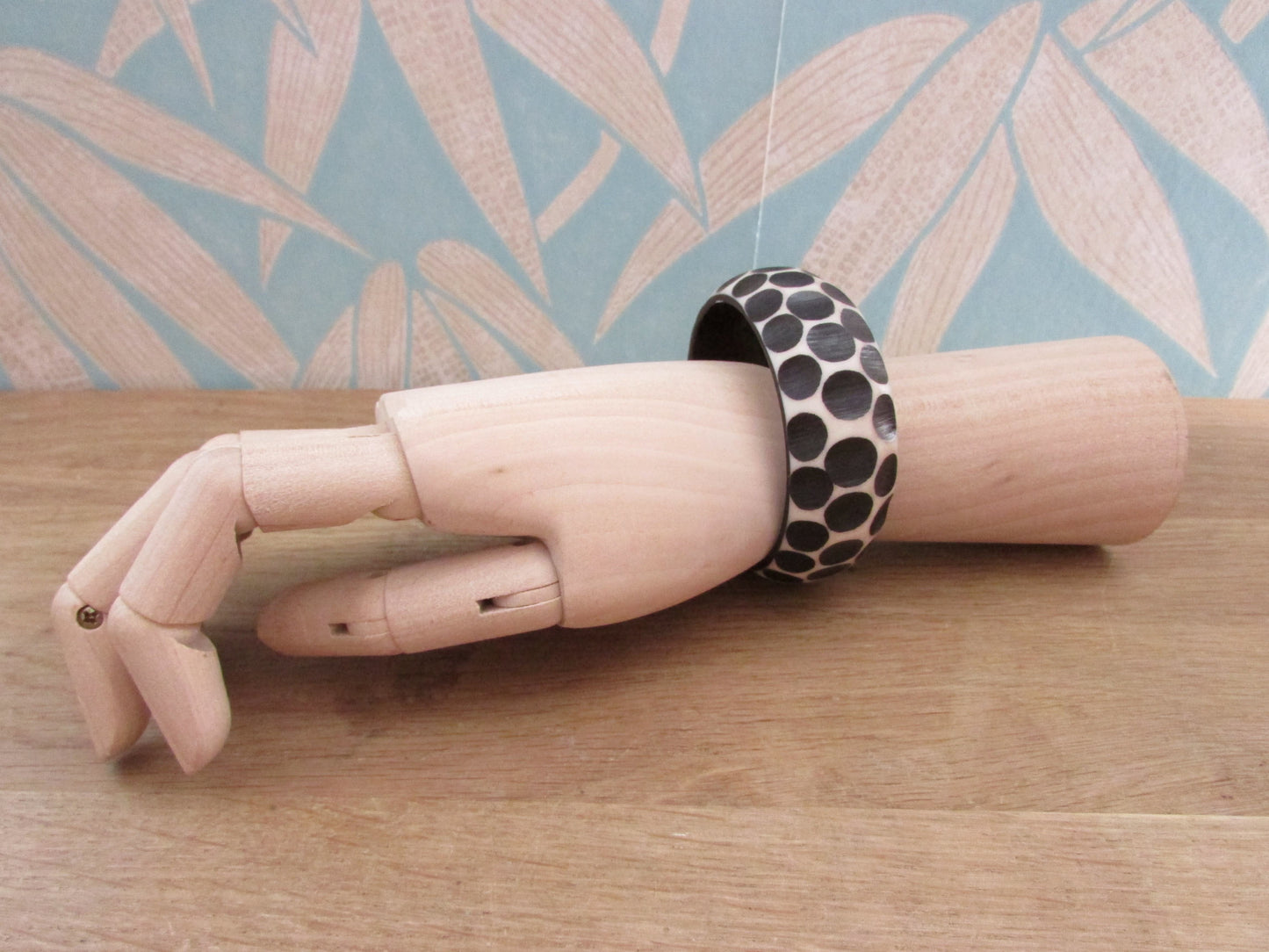 Pair of 1960s carved resin monochrome polka dot bangles