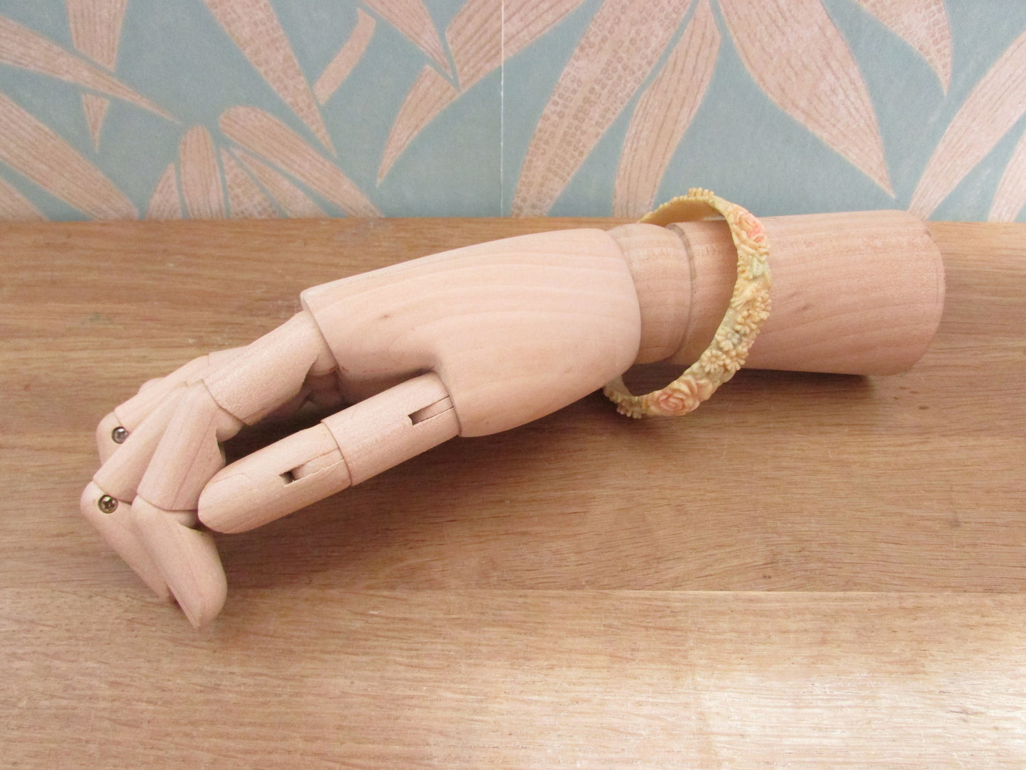 Art Deco carved floral resin/celluloid bangle, stamped Foreign