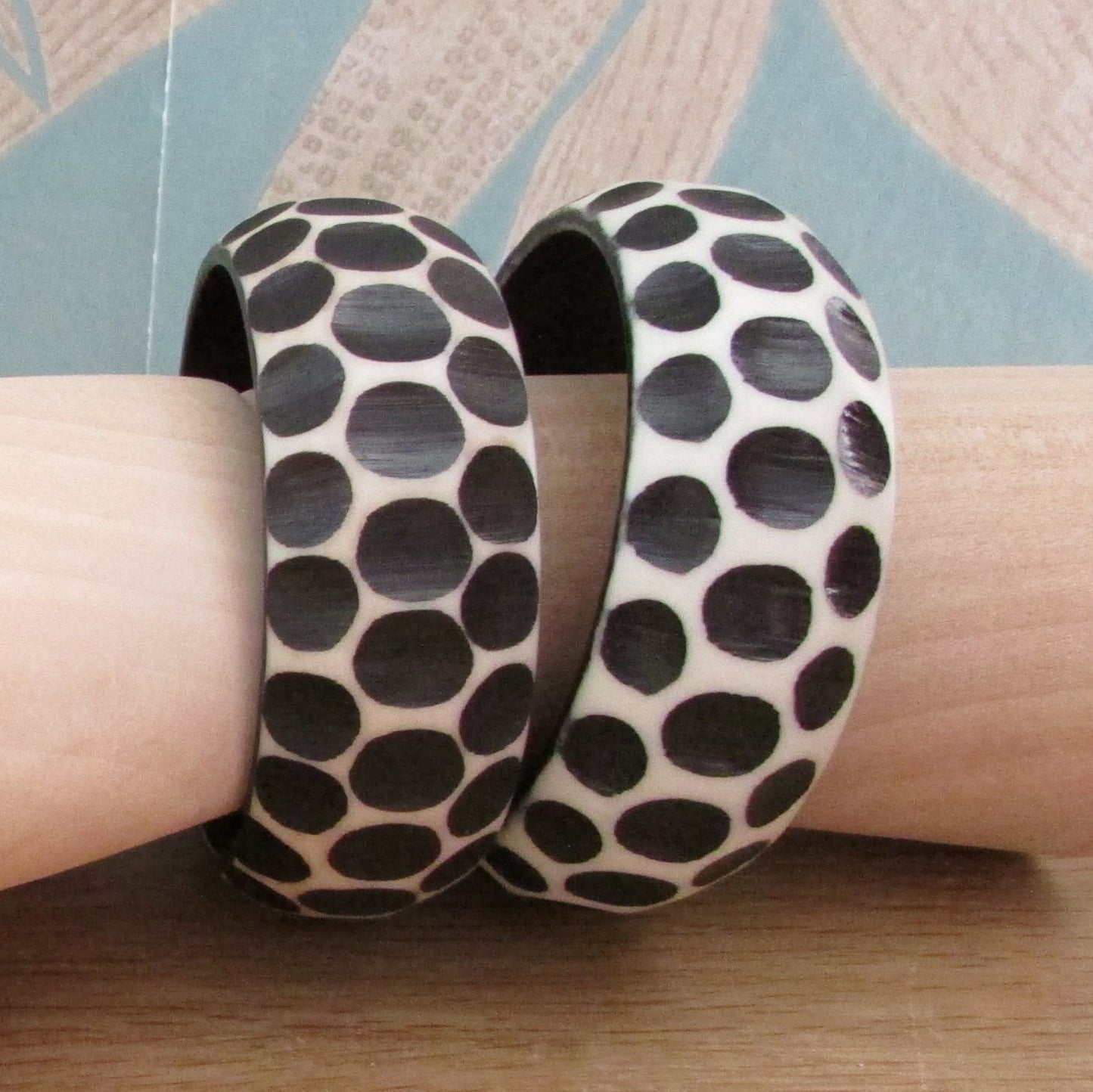 Pair of 1960s carved resin monochrome polka dot bangles