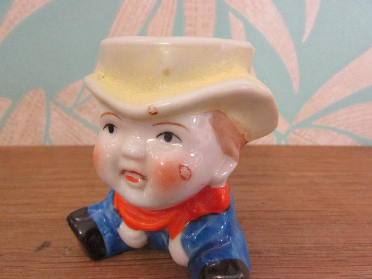 Vintage boy in yellow hat ceramic egg cup