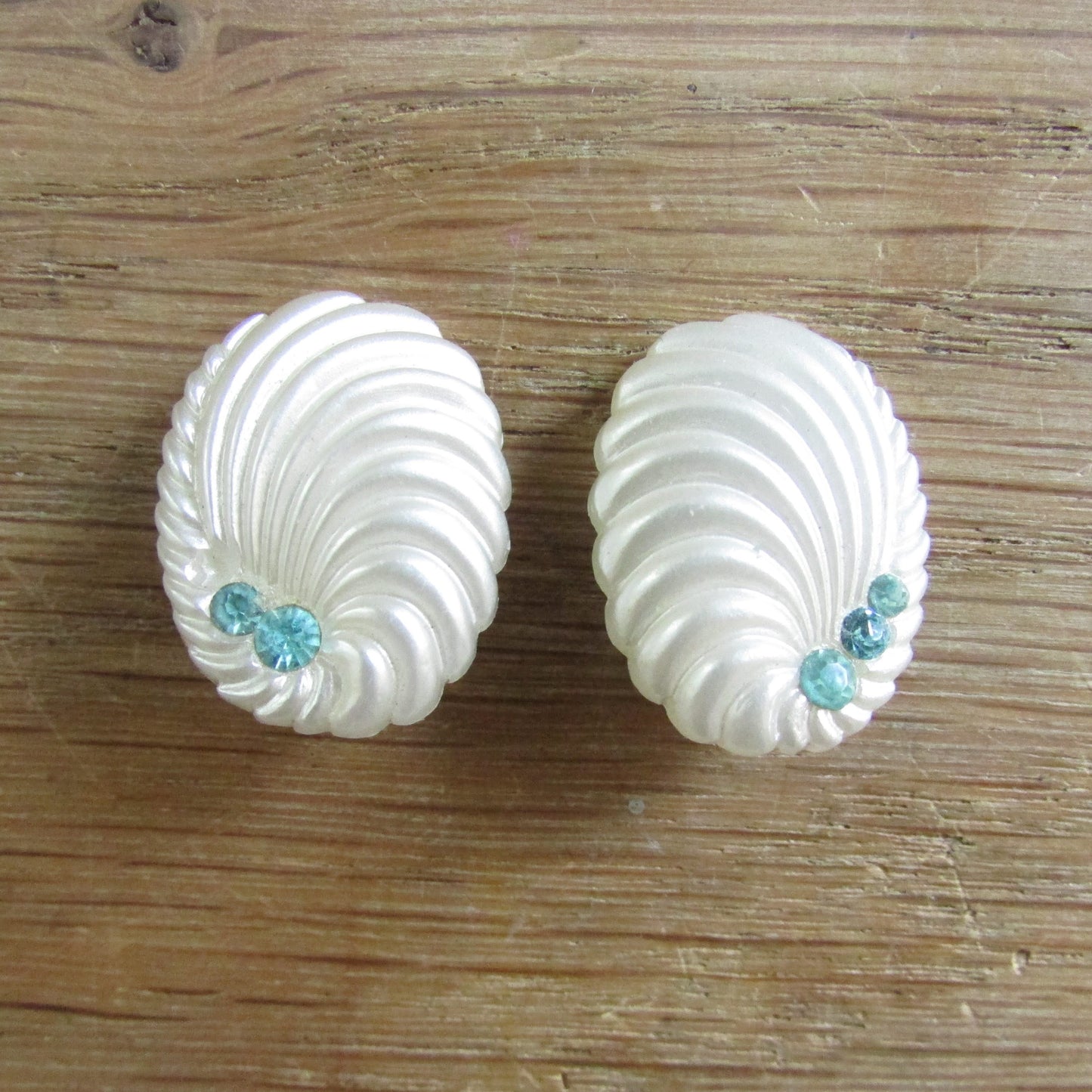 1950s/60s white shell style plastic clip-on earrings with blue rhinestones