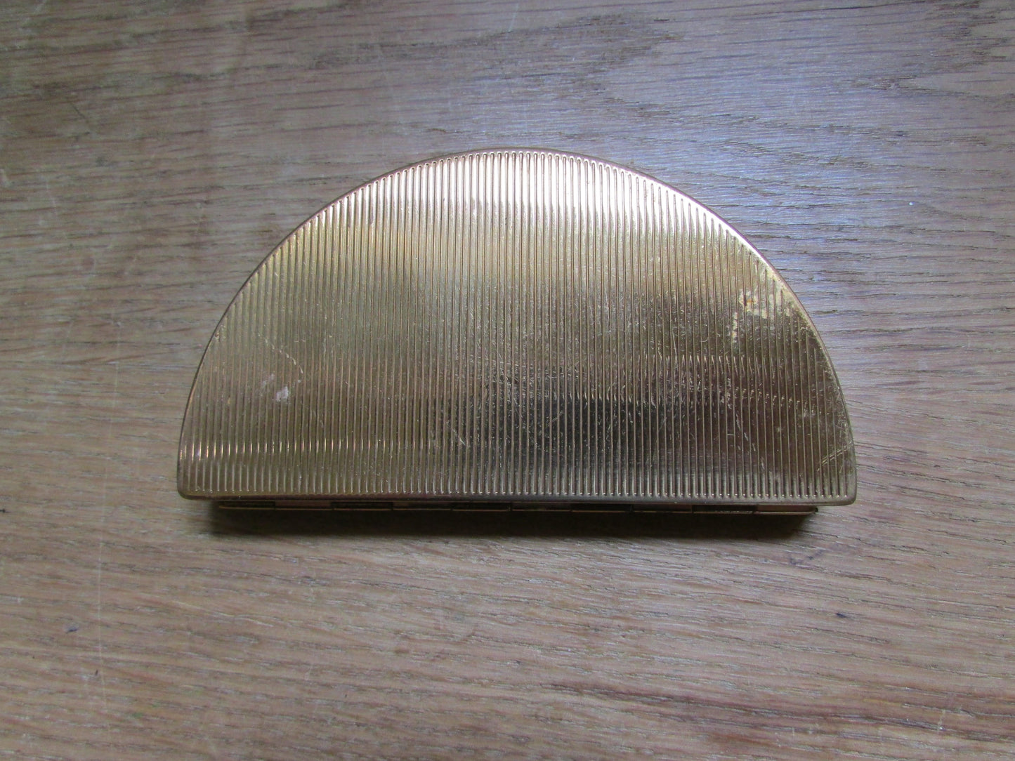 Unusual vintage needlepoint/petit point gold-tone half moon/crescent compact (empty)