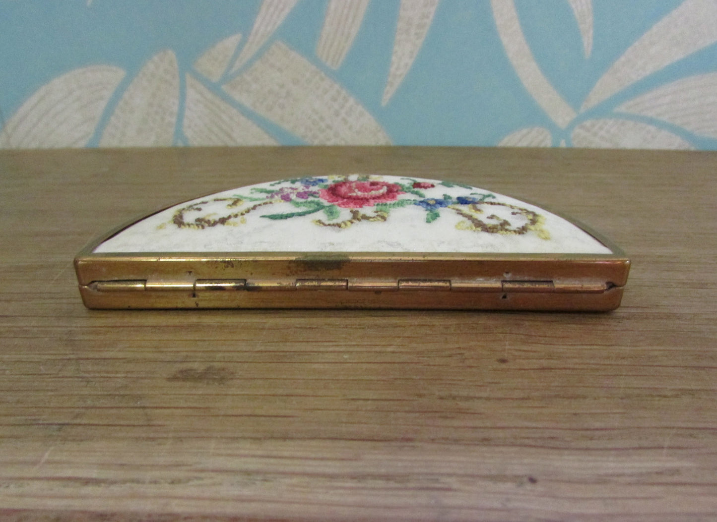 Unusual vintage needlepoint/petit point gold-tone half moon/crescent compact (empty)