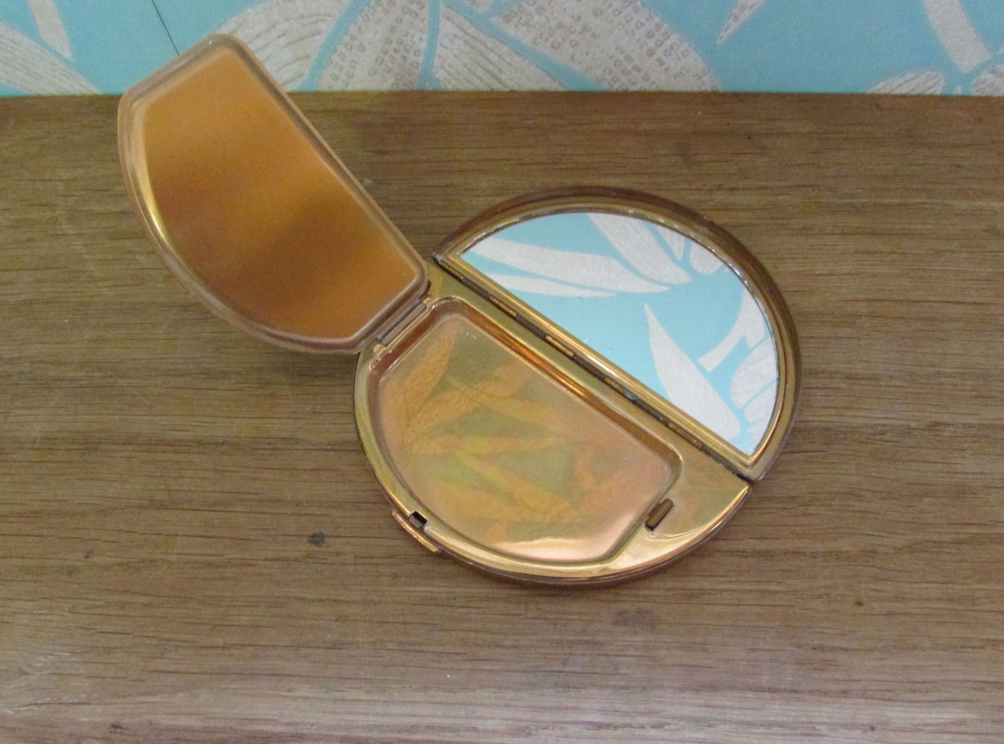 Unusual vintage needlepoint/petit point gold-tone half moon/crescent compact (empty)