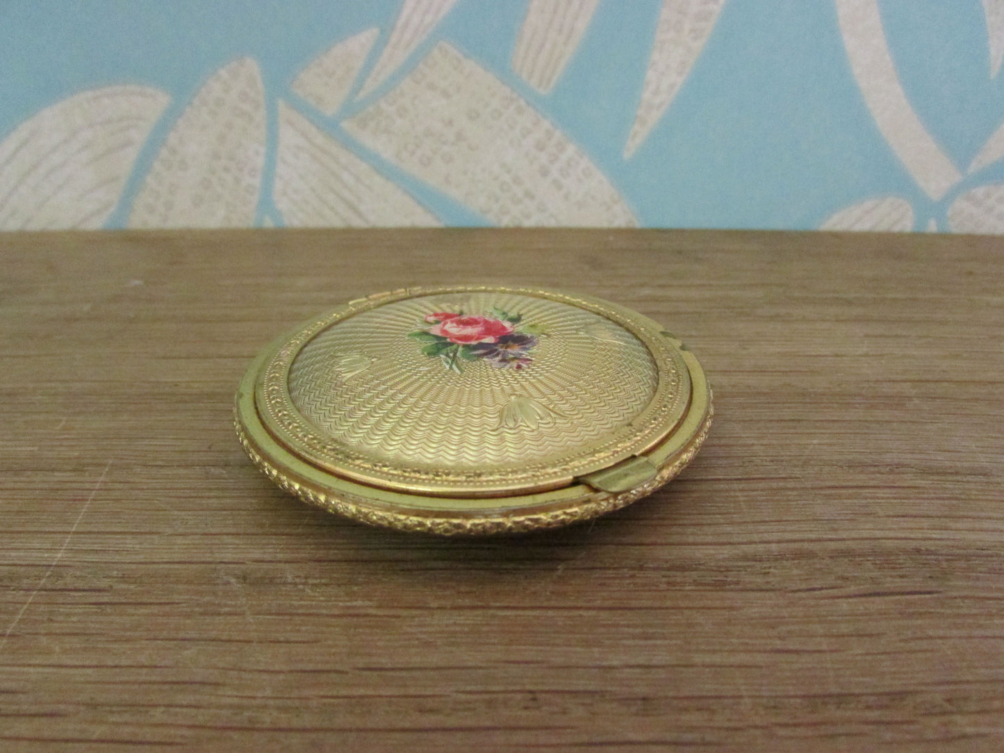 Vintage gold-tone mini compact with rose transfer