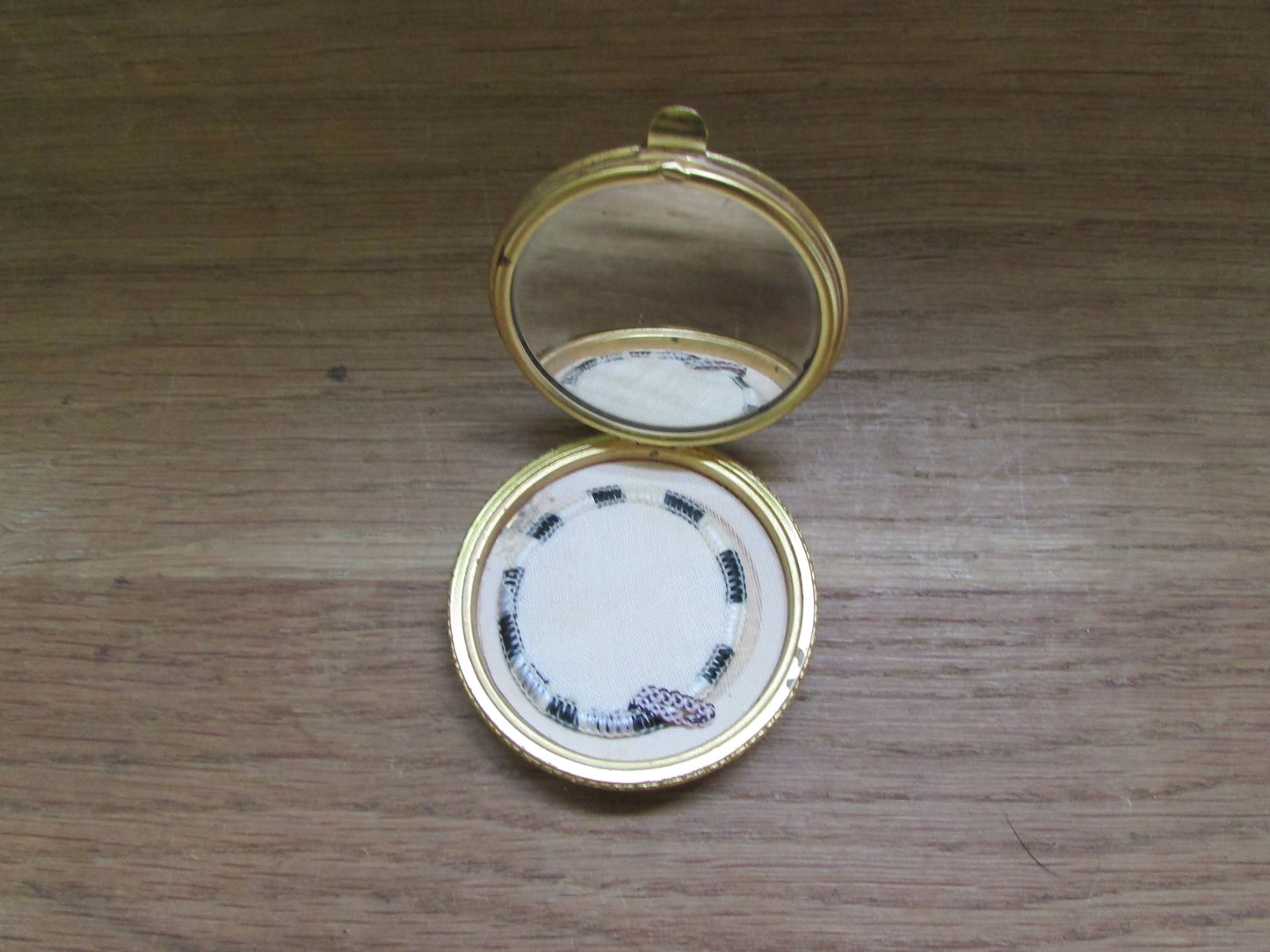 Vintage gold-tone mini compact with rose transfer