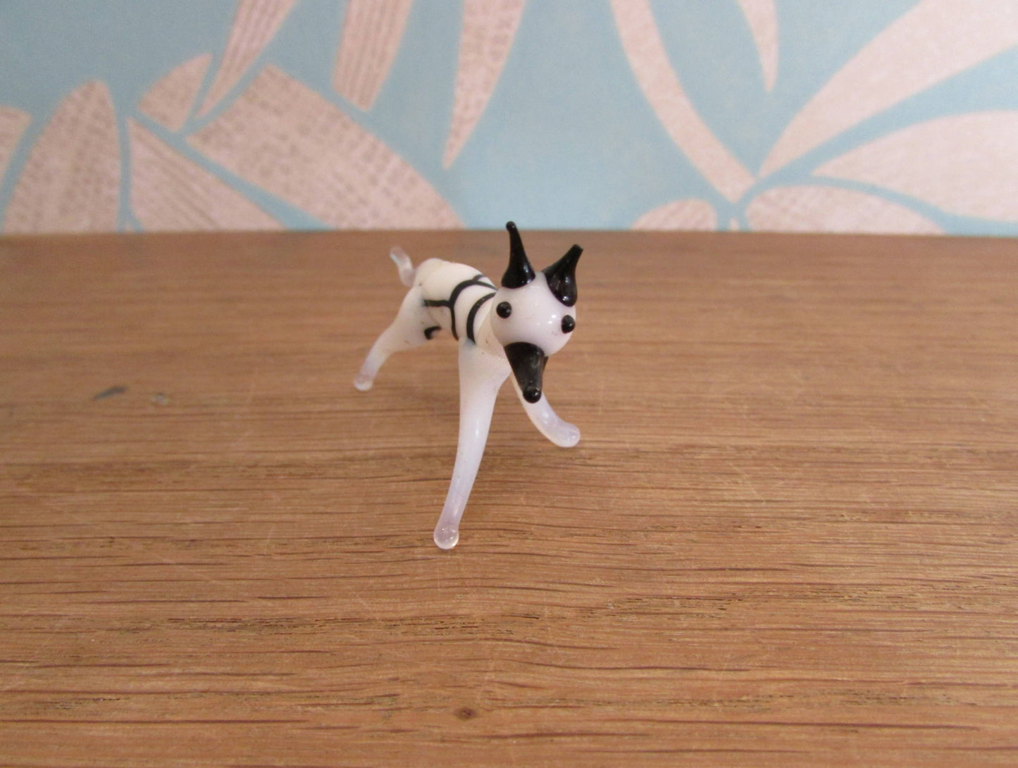 Vintage small blown glass black & white hound figurine