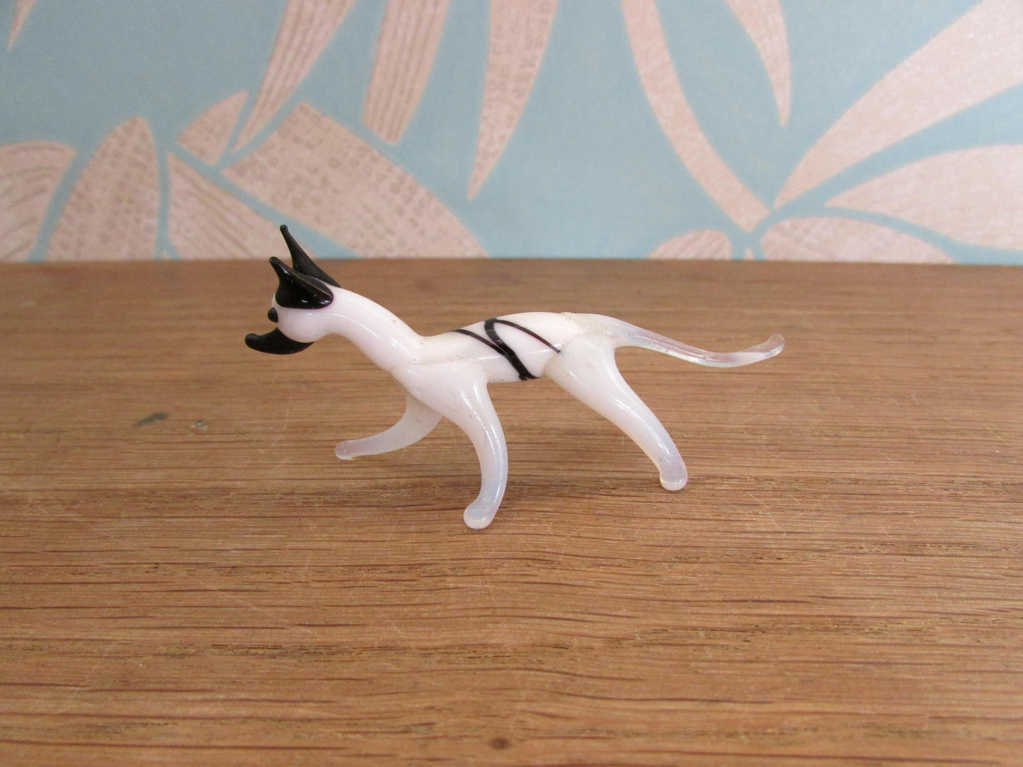 Vintage small blown glass black & white hound figurine